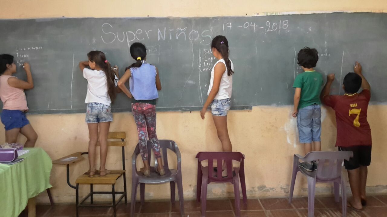 Kids at chalk board